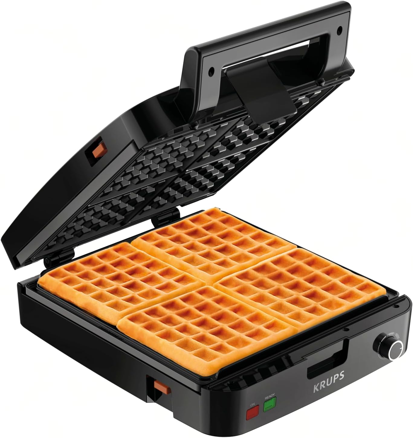 Golden Belgian waffles beside a stainless steel waffle maker